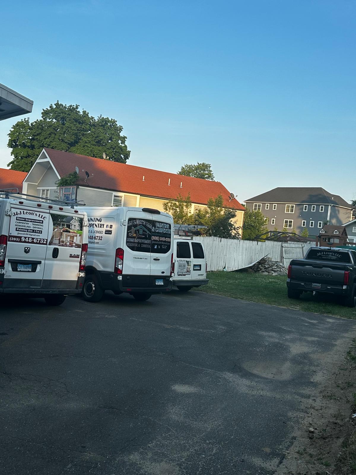 Construction workers reading blueprints for remodeling project